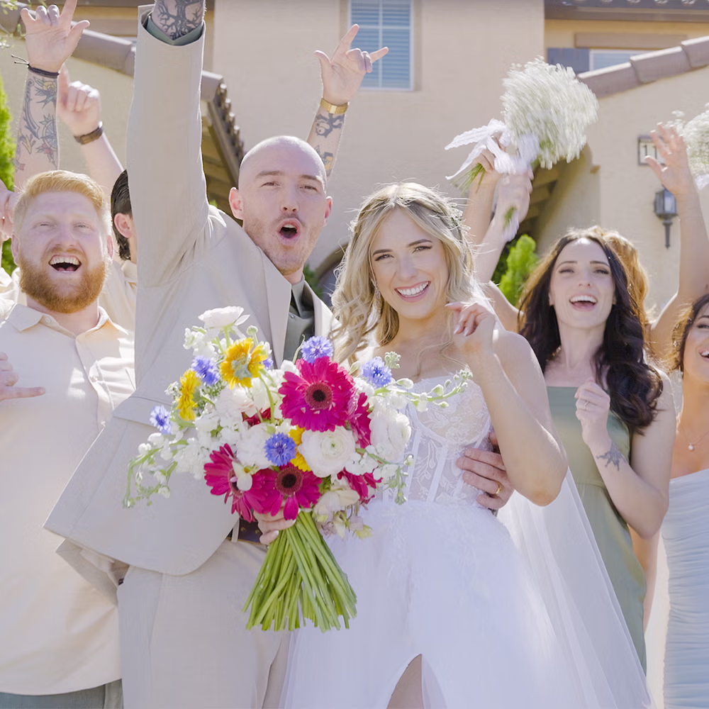 Guests celebrating together at an outdoor wedding